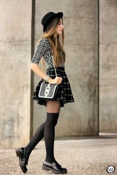 Black and white polka dot blouse with checkered mini skater skirt