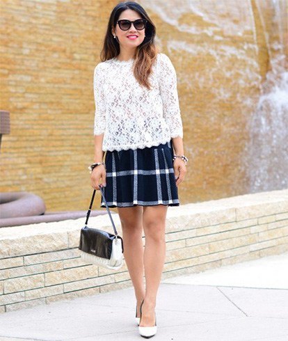 white lace blouse with serrated edge and black plaid skirt
