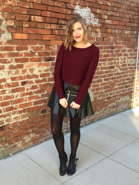 burgundy-colored sweater with black imitation leather skater skirt