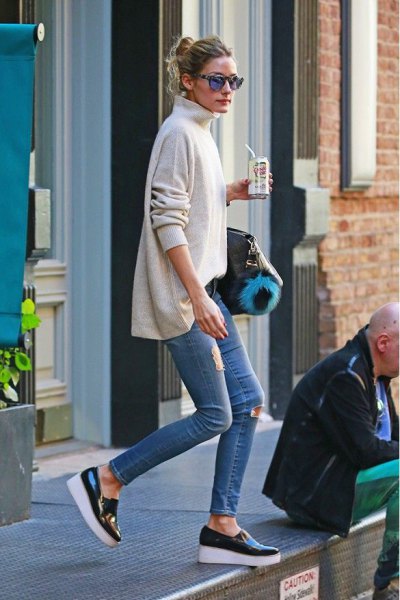 white mock neck sweater with skinny jeans and black wedge leather sneakers