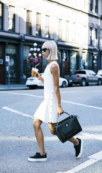 white sleeveless mini dress with black sneakers