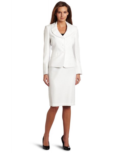 white suite jacket with knee-length, straight cut dress and black heels
