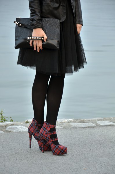 black leather jacket with mini tulle skirt and red checkered heels