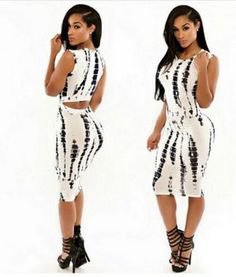 black and white figure-hugging midi dress with strappy heels