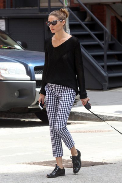 black comfortable sweater with v-neck and checked trousers