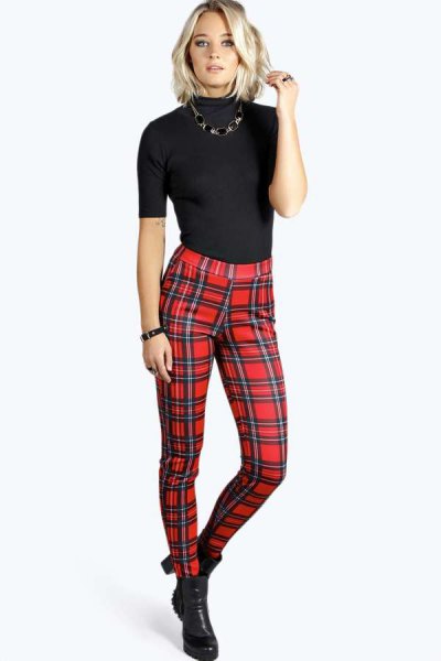 black short-sleeved sweater with mock-neck and red checked pants