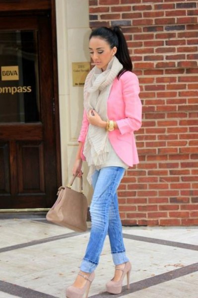 pink blazer with blue cut slim fit jeans and high heels