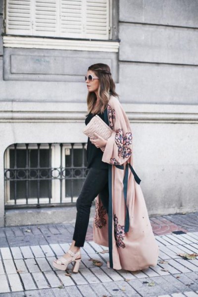 Blushing maxi coat with black top and matching skinny jeans