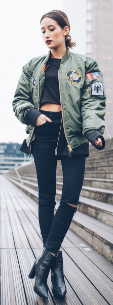 gray pilot jacket with black, short-cut t-shirt and leather boots