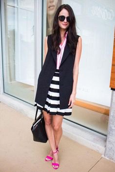 black sleeveless longline blazer with striped mini skirt and open toe heels