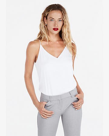 white v-neck tank and gray slim fit jeans