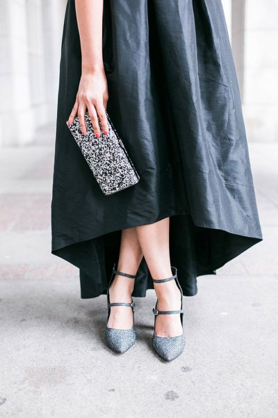 black leather maxi dress with silver sequin clutch