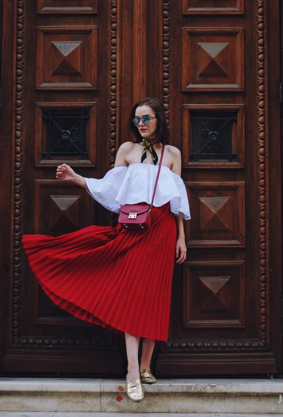 light blue off shoulder blouse with red midi pleated skirt