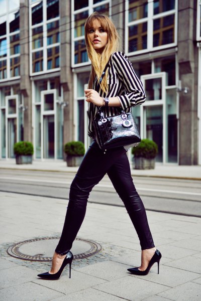 black and white striped shirt with buttons and leather leggings