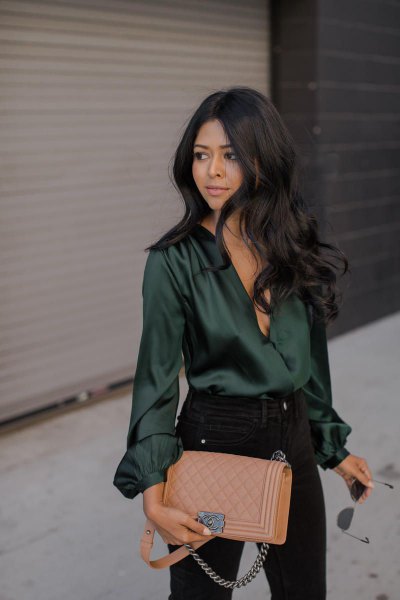 Emerald green silk long sleeve top with black skinny jeans