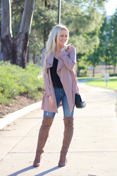 pink trench coat with blue skinny jeans and over the knee boots