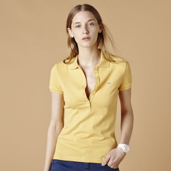 Light yellow polo shirt with dark blue skinny jeans