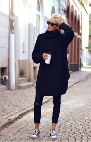 black sweater dress with torn skinny jeans