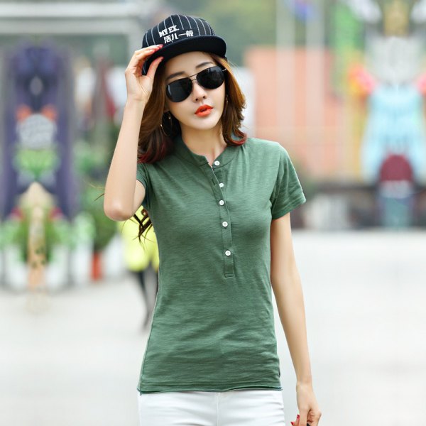 green collarless polo shirt with white jeans and baseball cap