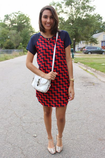 Dark blue and red mini shift dress with zigzag print and silver strappy sandals