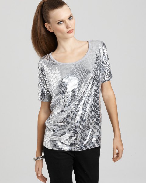 silver top with scoop neck and black slim fit trousers