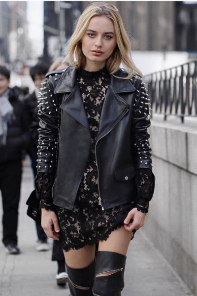 Leather jacket with black and silver spikes and mini dress made of lace