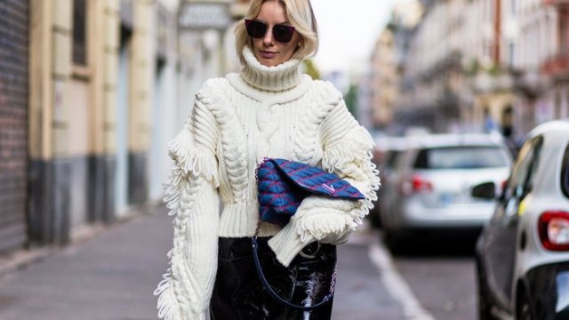 white turtleneck with cable pattern and black leather pants