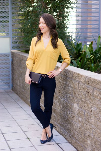 lighter mustard-colored blouse with V-neck and chinos