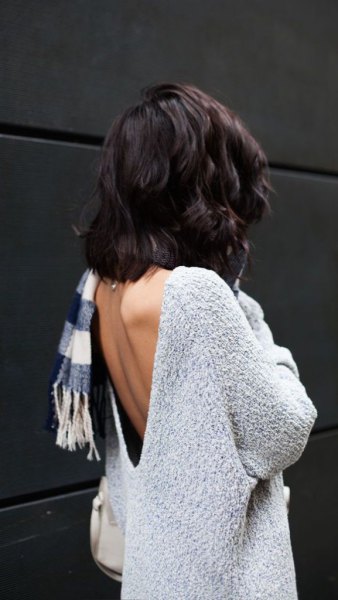 light mottled gray sweater with checkered scarf