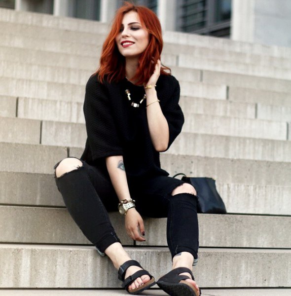 black sweater with knee-high jeans and slide sandals