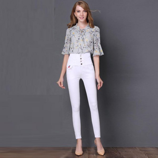 Blush pink printed chiffon bell sleeve blouse with white button placket and high waisted jeans