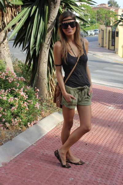 Tank top with scoop neck and green mini shorts