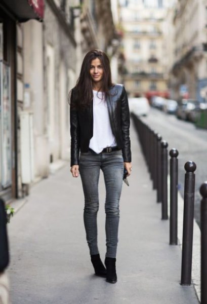 black leather jacket with white oversized t-shirt and gray skinny jeans