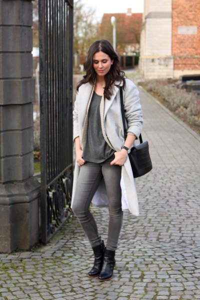 light gray longline coat with oversized t-shirt and leather ankle boots