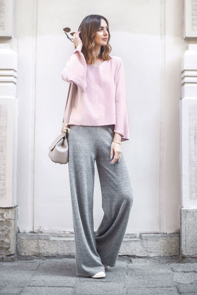 white long-sleeved top with gray trousers with wide legs