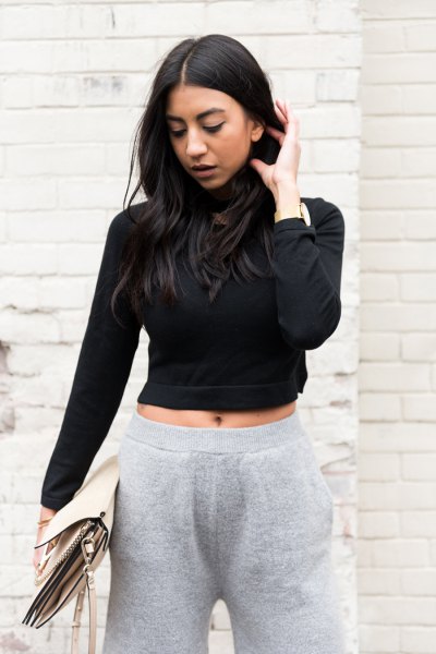 black, short-cut turtleneck with gray knit trousers with wide legs