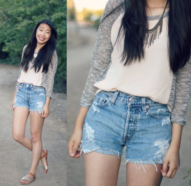 Light pink chiffon top with a gray mottled cardigan and blue mini jeans shorts