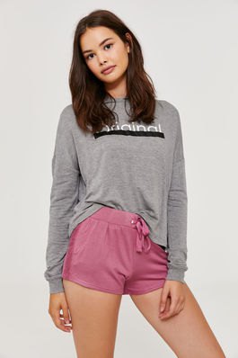gray graphic sweatshirt with blushing pink sweat shorts with high waist