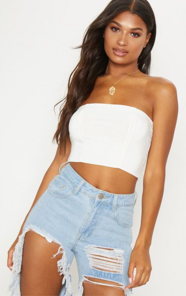 short tube top with heavily torn boyfriend jeans