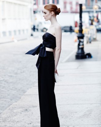 black, short, knotted top with wide-leg trousers