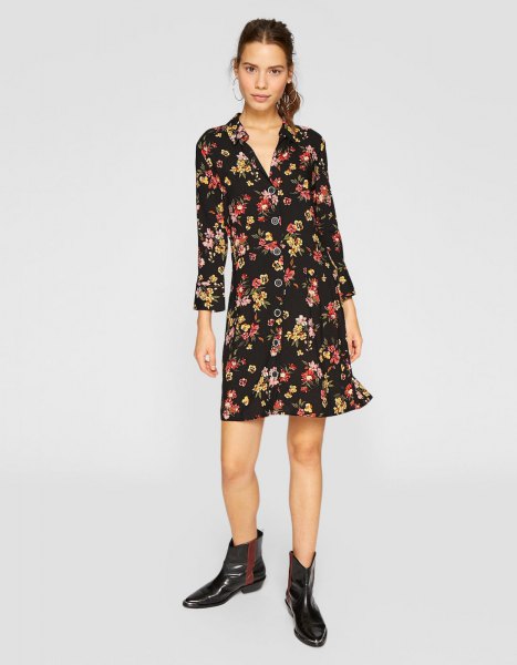 black mini long-sleeved dress with floral pattern and V-neck and leather boots