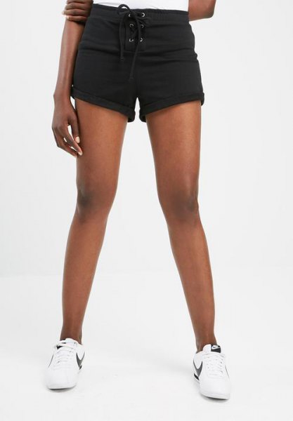 black mini sweat shorts with cuff, white t-shirt and sneakers