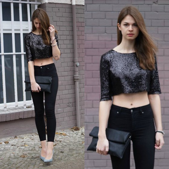 black short sequin top with skinny jeans and leather handbag