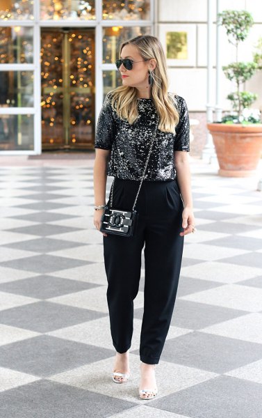 black sparkling top with matching chinos and white sandals