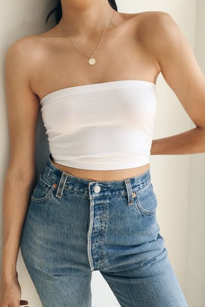 white short strapless top with blue skinny jeans