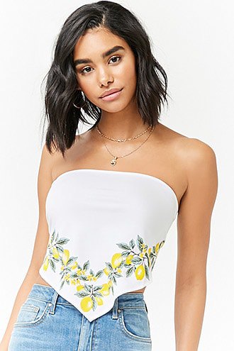 white strapless top with floral pattern and blue mom jeans