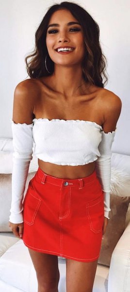 white long-sleeved strapless short blouse with orange mini skirt