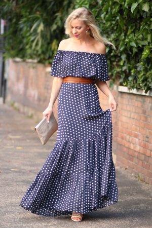 Dark blue and white polka dots on the maxi dress with a shoulder belt