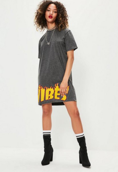 gray and yellow graphic t-shirt dress with medium calf boots