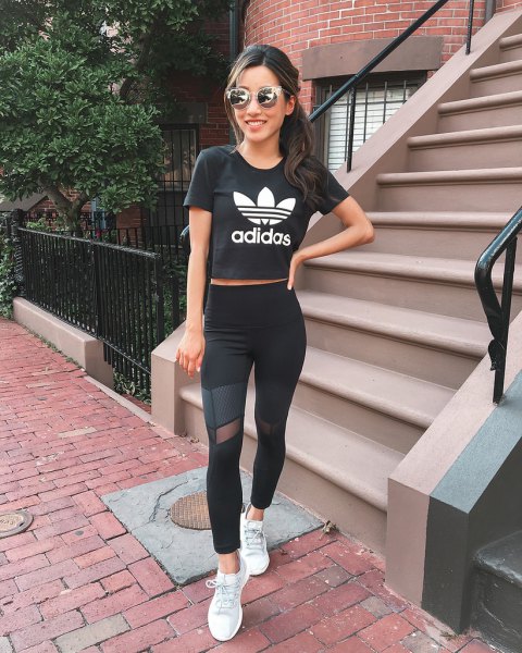 black short graphic t-shirt with mesh leggings and white sneakers